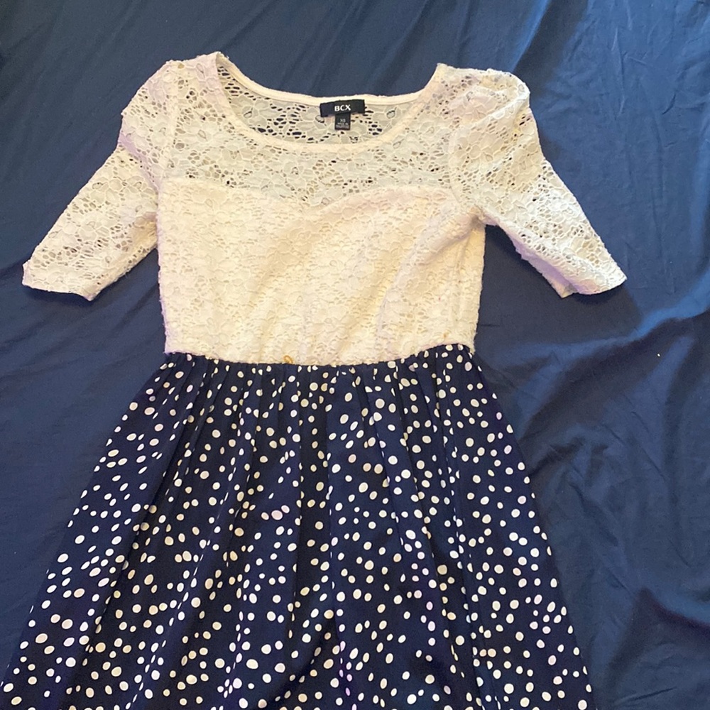 White and navy dress with yellow belt